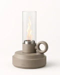 Compact cylindrical tabletop ethanol fireplace with a glass wind guard