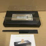 Square tabletop ethanol fireplace displayed with its instruction sheet and extinguisher