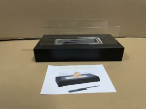 Square tabletop ethanol fireplace displayed with its instruction sheet