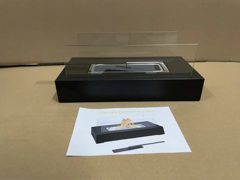 Square tabletop ethanol fireplace displayed with its instruction sheet