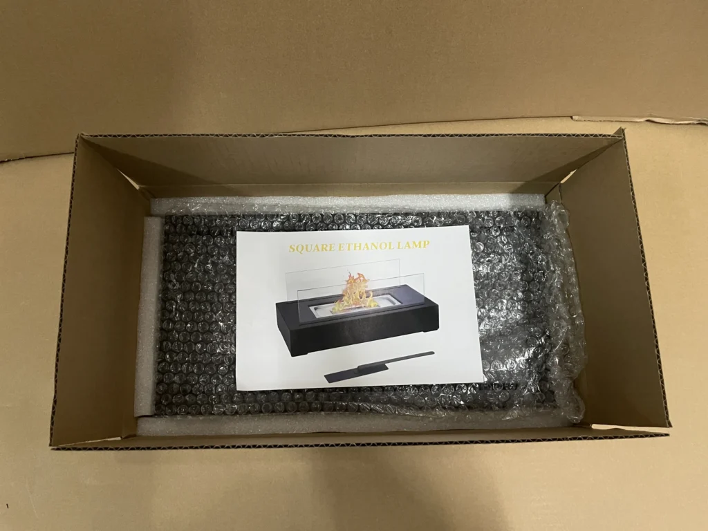 Packaging detail for a square tabletop ethanol fireplace