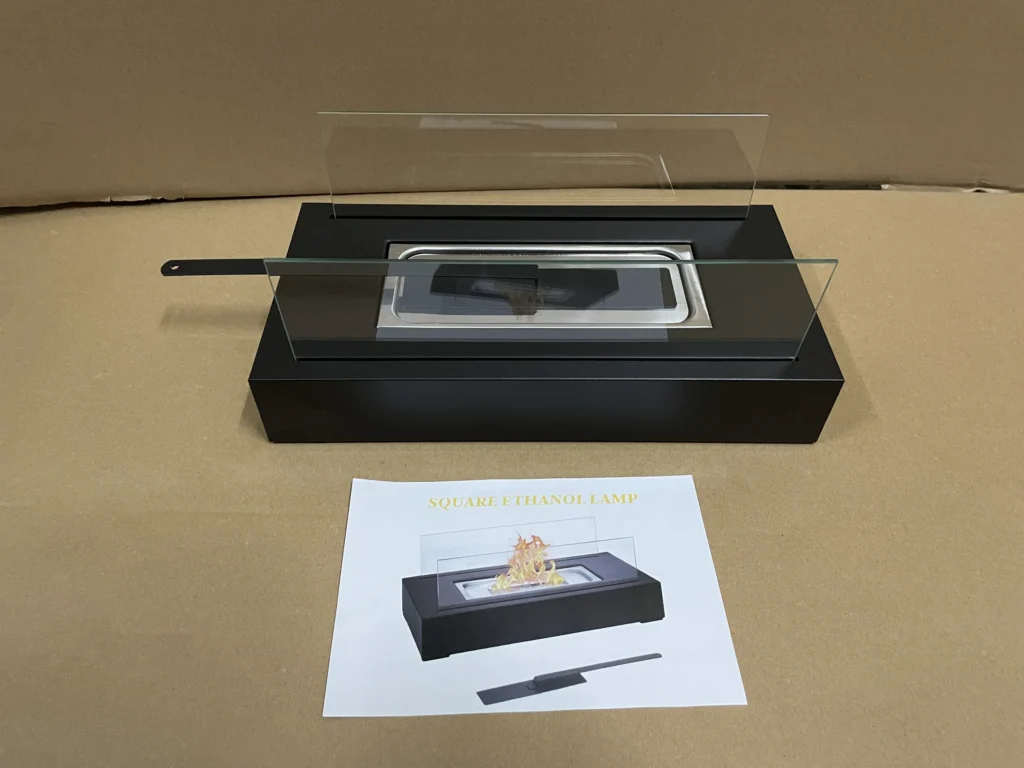 Square tabletop ethanol fireplace displayed with its instruction sheet