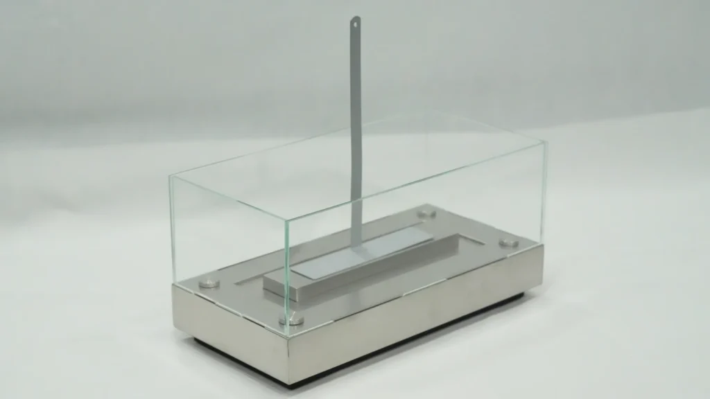 Manually operated rectangular tabletop ethanol fireplace with extinguishing tool