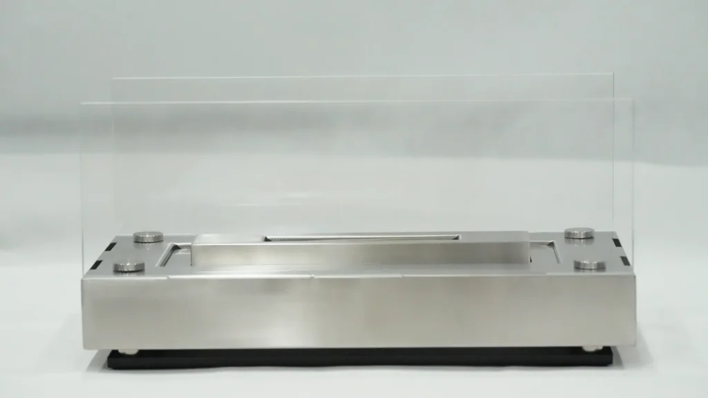Front view of an unlit rectangular tabletop ethanol fireplace sample